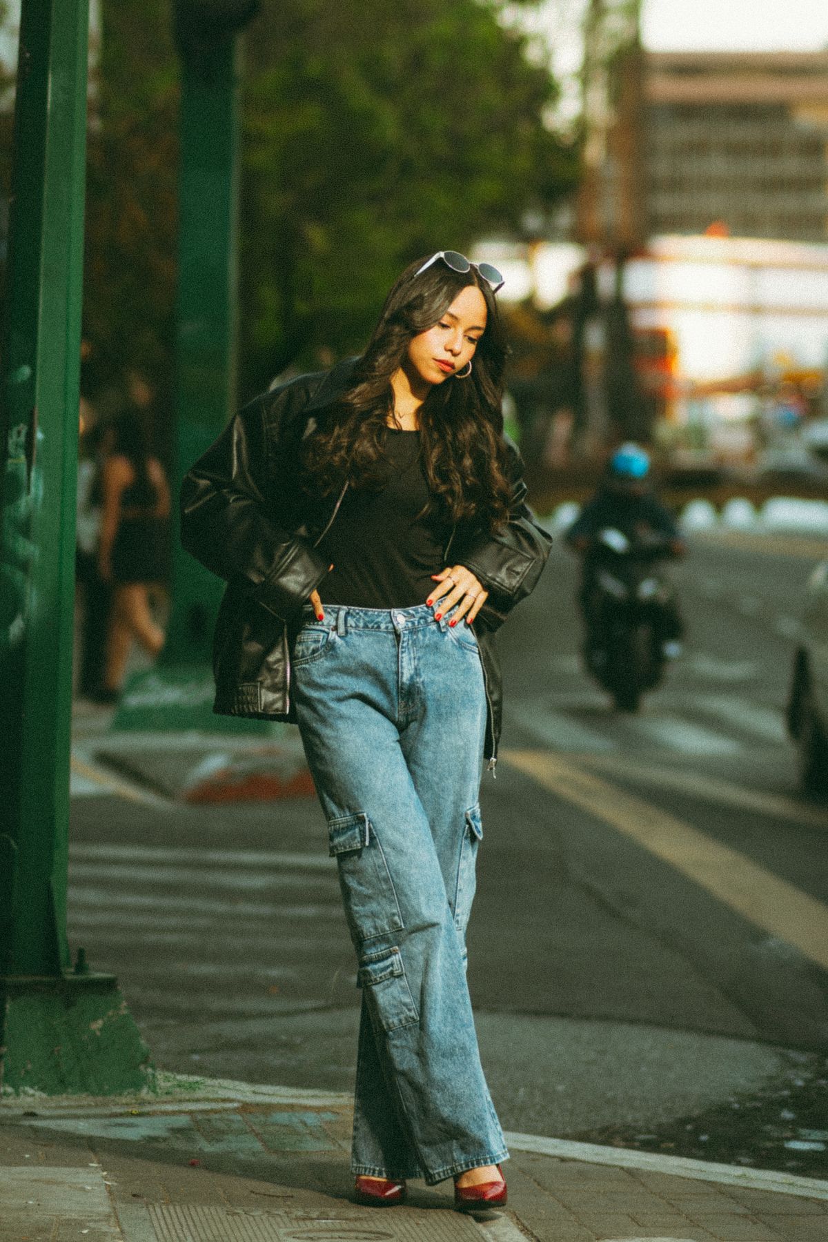 A woman in a casual denim outfit on a city street